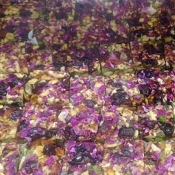 Rose Petal & Dry Fruit Squares — tray of squares topped with dried rose petals and nuts
