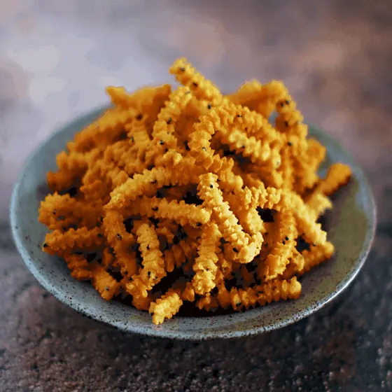 Spiral Murukku Sticks — short ridged spiral murukku sticks in a grey bowl